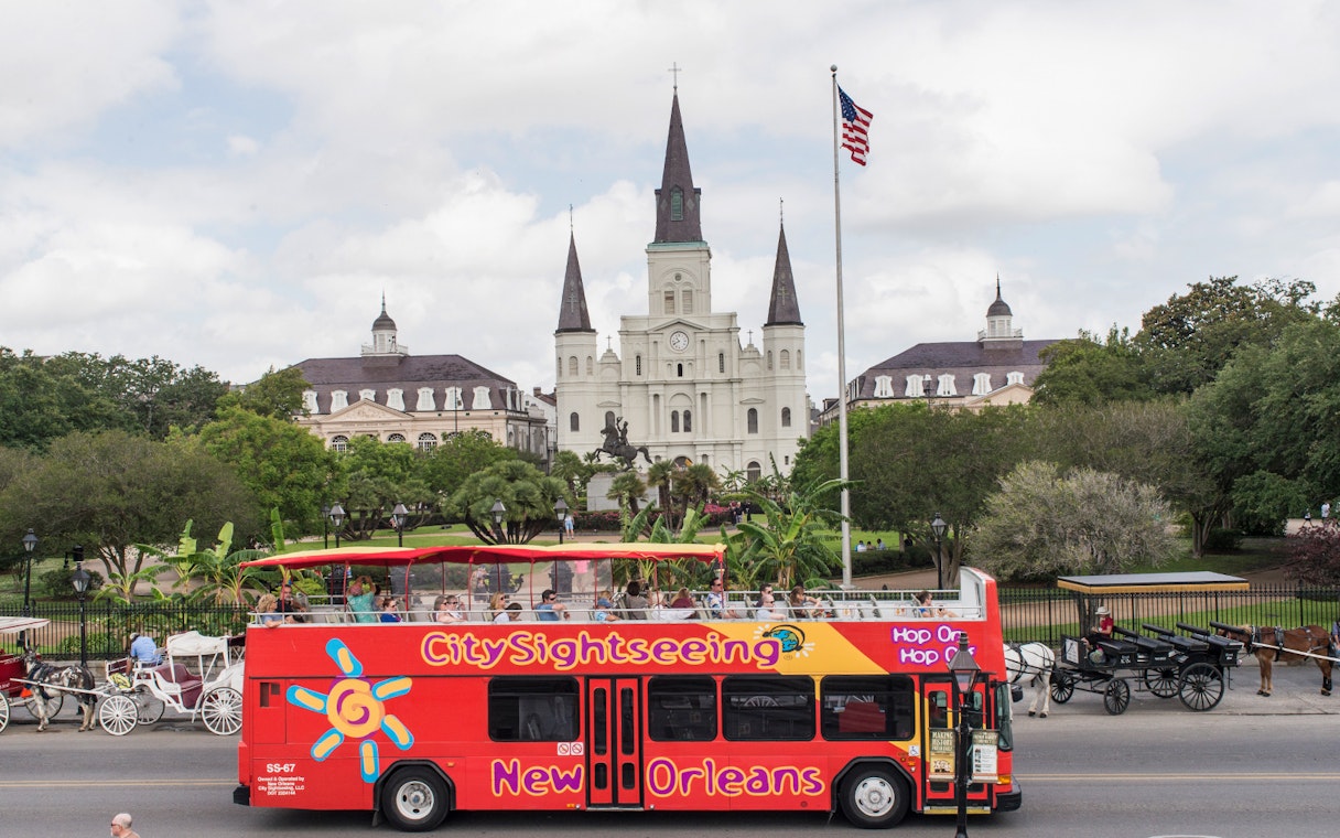 Hop-on hop-off bus in front of St. Louis Cathedral, New Orleans.