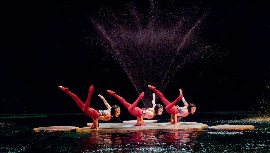 Acrobats performing on water stage in Cirque du Soleil's "O" show, Las Vegas.