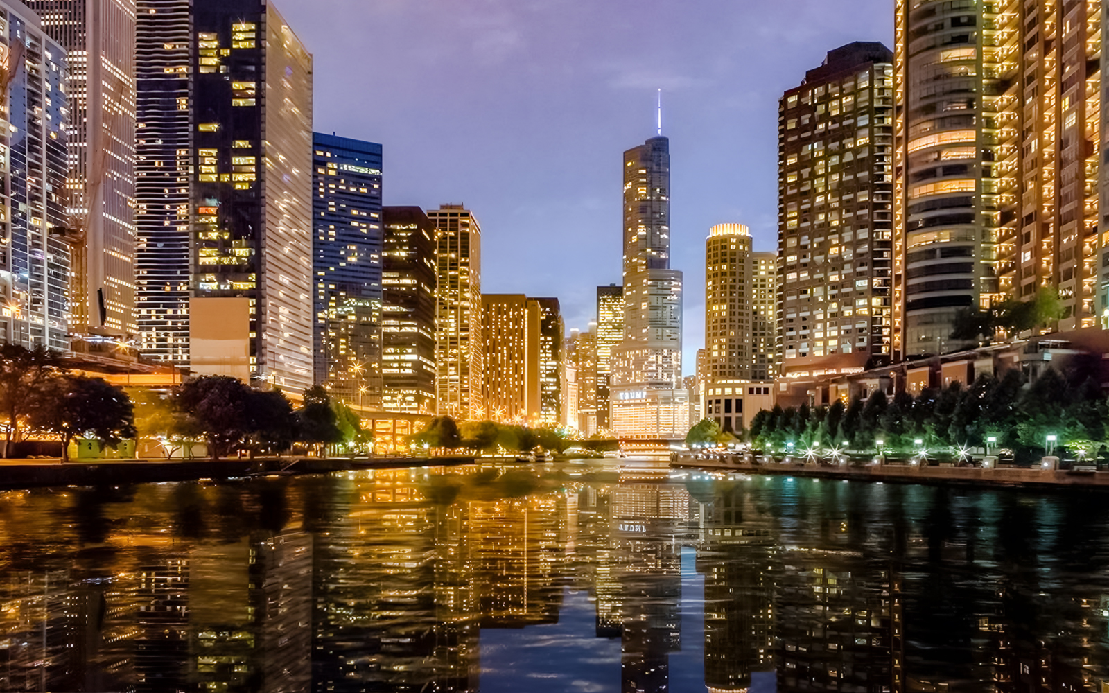 Chicago skyline at sunset reflecting on Lake Michigan during a 90-minute scenic cruise.