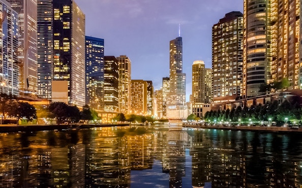 Chicago skyline at sunset reflecting on Lake Michigan during a 90-minute scenic cruise.