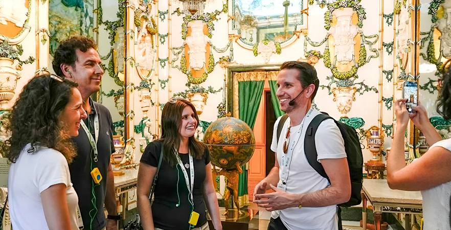 Tour group enjoying a guided visit inside the Royal Palace of Madrid.