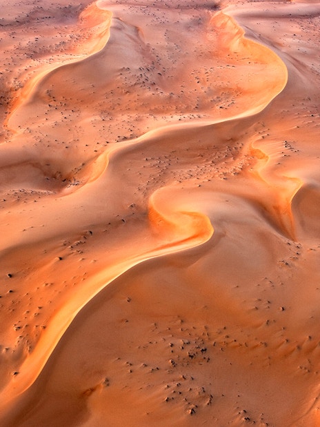 Aerial view of sand dunes in Ras Al Khaimah during a hot air balloon ride.