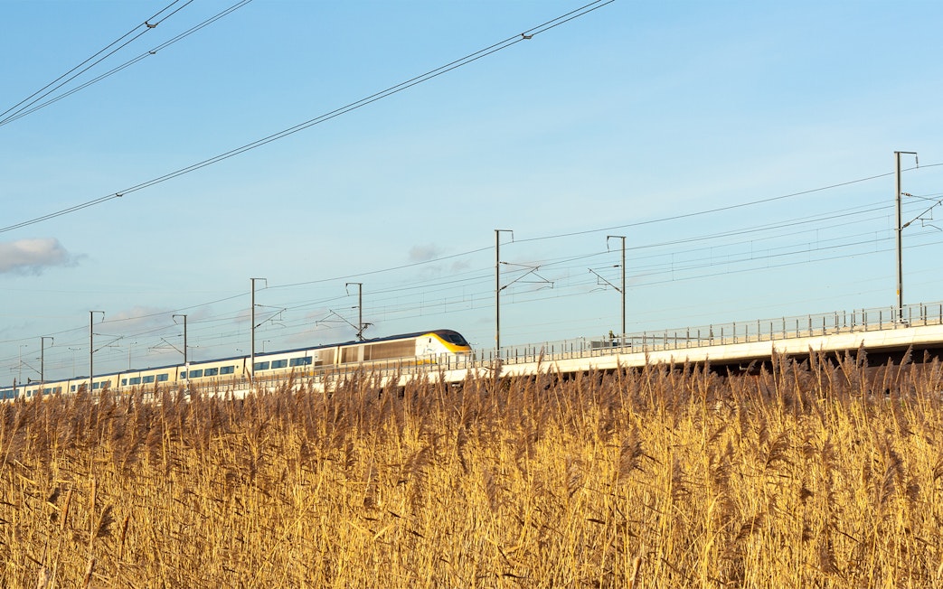Train traveling through countryside en route to Paris for Eiffel Tower lunch.