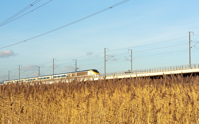 Train traveling through countryside en route to Paris for Eiffel Tower lunch.