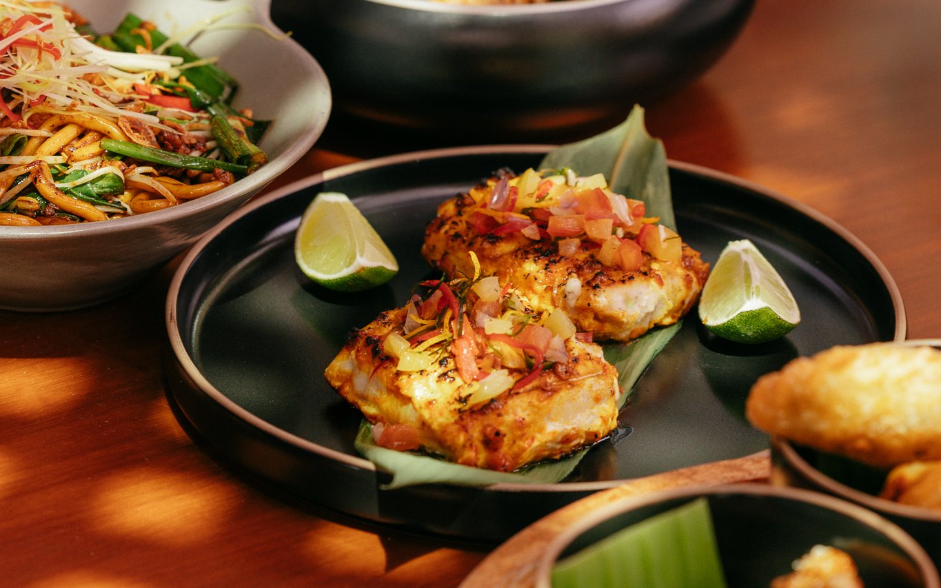 Grilled fish with diced vegetables and lime at Andaliman brunch, Dubai.