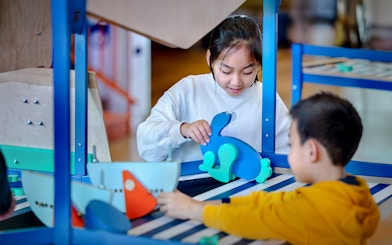 Children engaging with interactive exhibits at NEMO Science Museum.