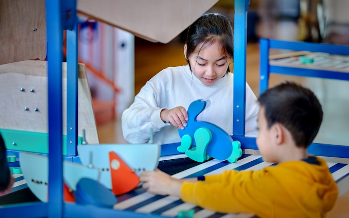 Children engaging with interactive exhibits at NEMO Science Museum.