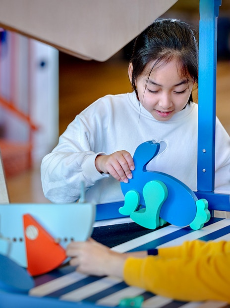Children engaging with interactive exhibits at NEMO Science Museum.