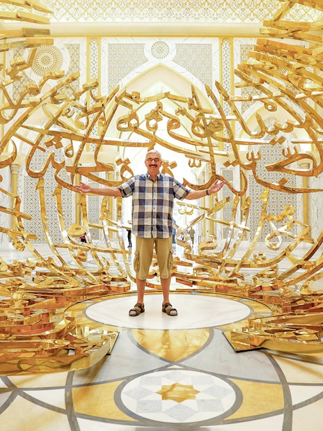 Golden Arabic calligraphy sculpture at Qasr Al Watan, Abu Dhabi.