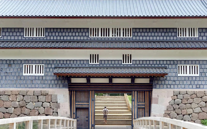 Kanazawa Castle gate with stone walls and traditional architecture.