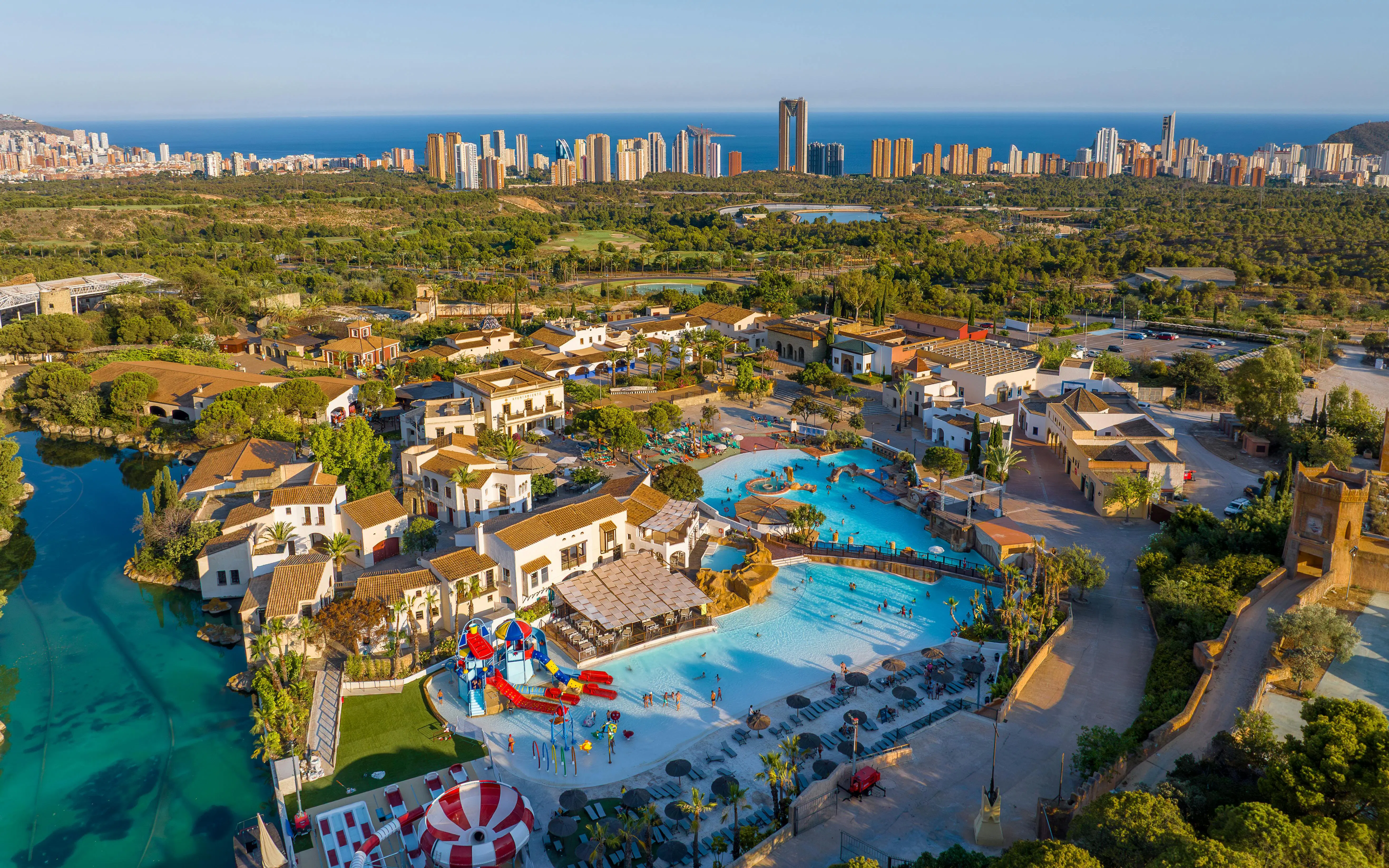 Aerial view of Terra Mitica theme park in Spain with pools and attractions.
