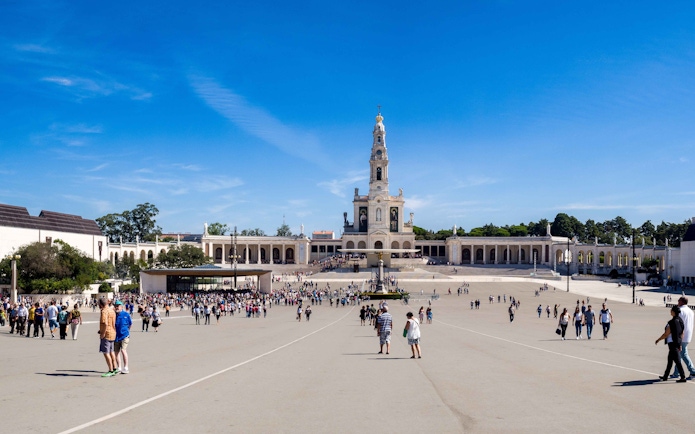 Crowds at Basilica of Our Lady of the Rosary in Fatima Sanctuary, Portugal.