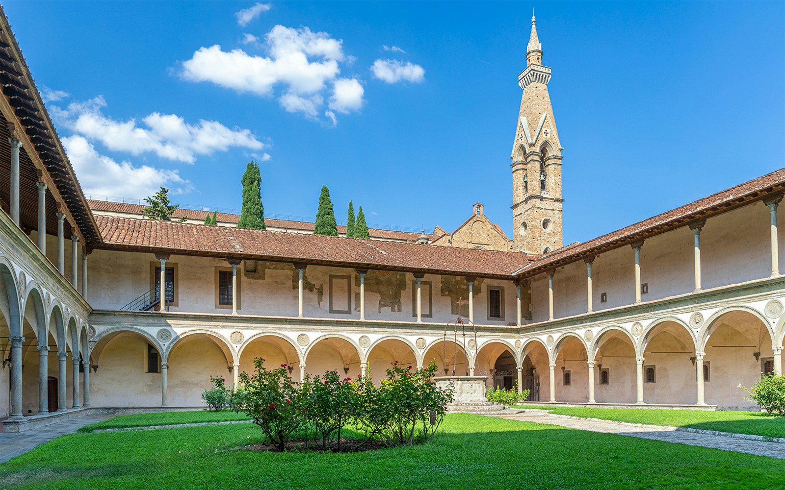Cloisters of Santa Croce Basilica Complex with arches and central garden in Florence.