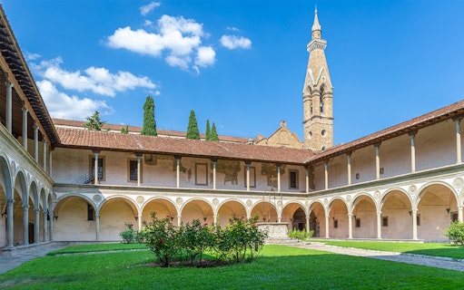 Cloisters of Santa Croce Basilica Complex with arches and central garden in Florence.