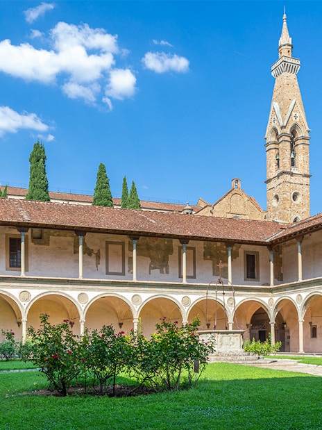 Cloisters of Santa Croce Basilica Complex with arches and central garden in Florence.