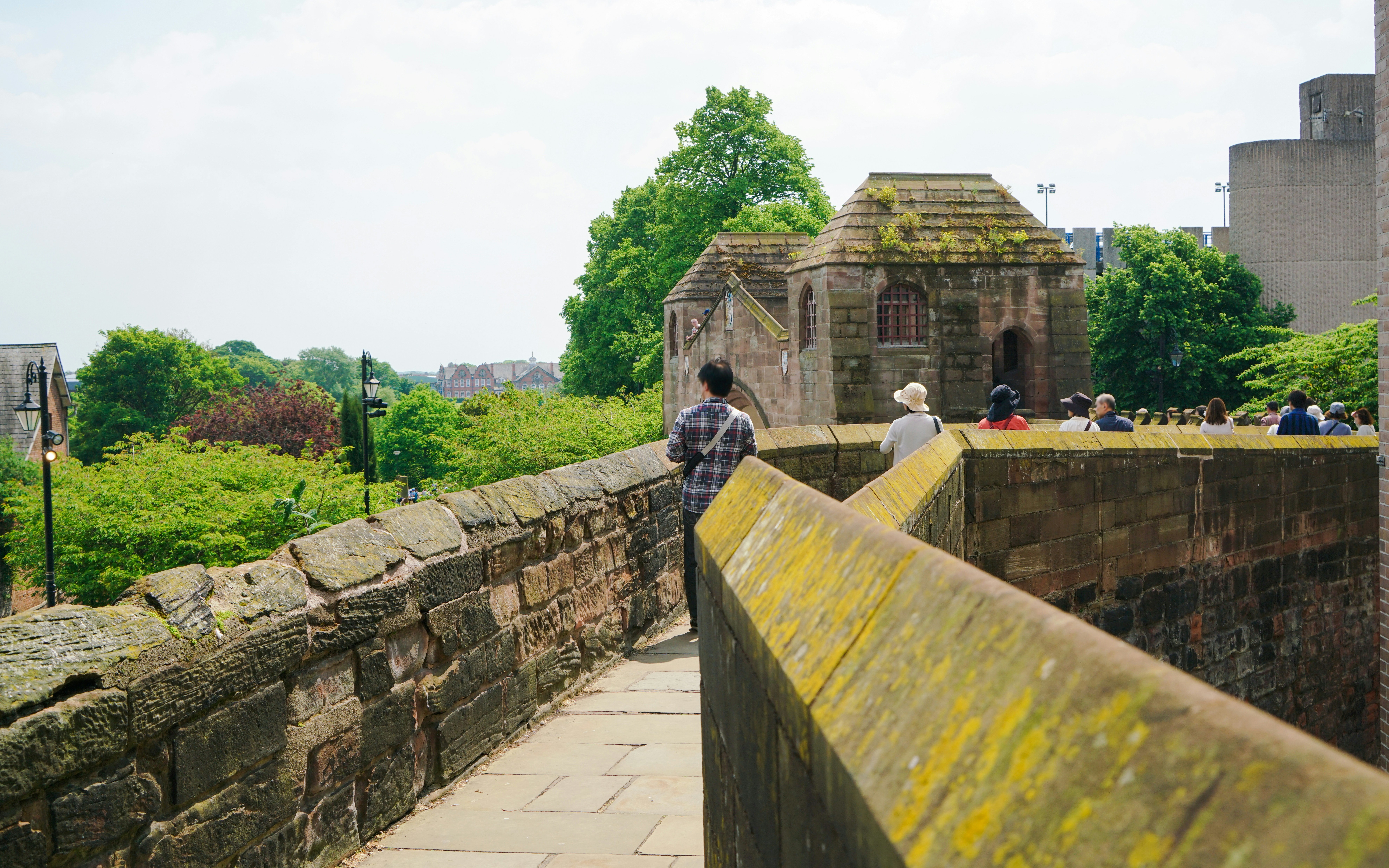 People exploring Chester city wall