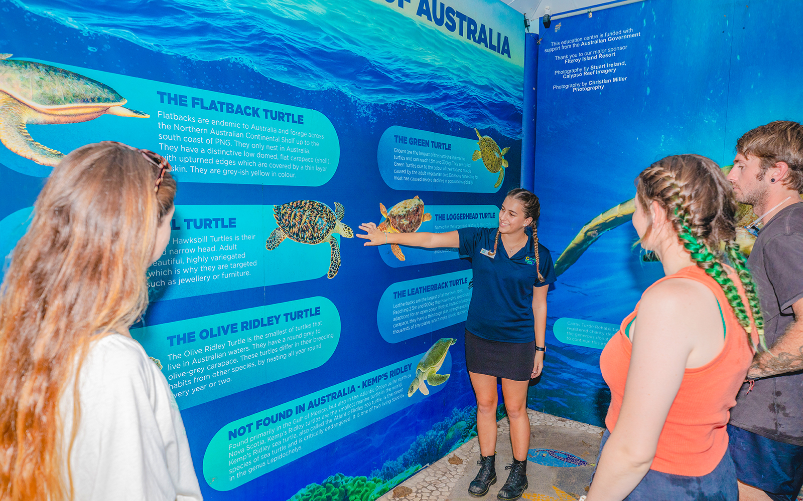 Tourists learning about turtles from a guide at the Turtle Rehabilitation Centre, Fitzroy Island.
