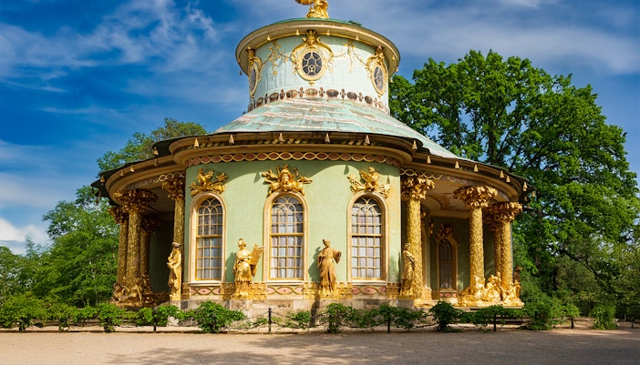 Brandenburg Pavilion in Berlin with tourists exploring the historic site.
