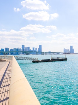 City skyline with towers and skyscrapers viewed from Saadiyat Island, Abu Dhabi.