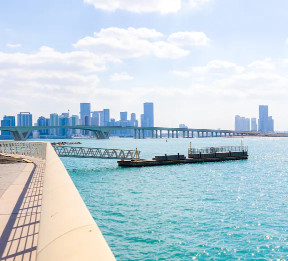 City skyline with towers and skyscrapers viewed from Saadiyat Island, Abu Dhabi.