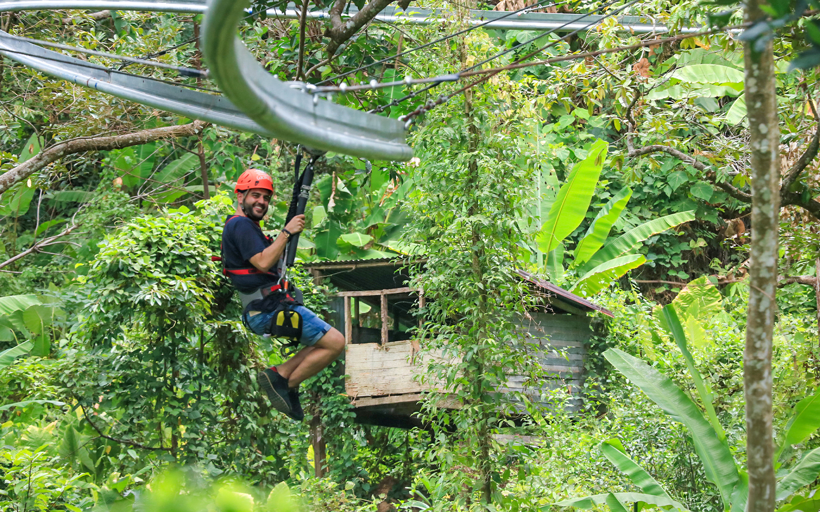 Ziplining through lush jungle at Hanuman World, Phuket.