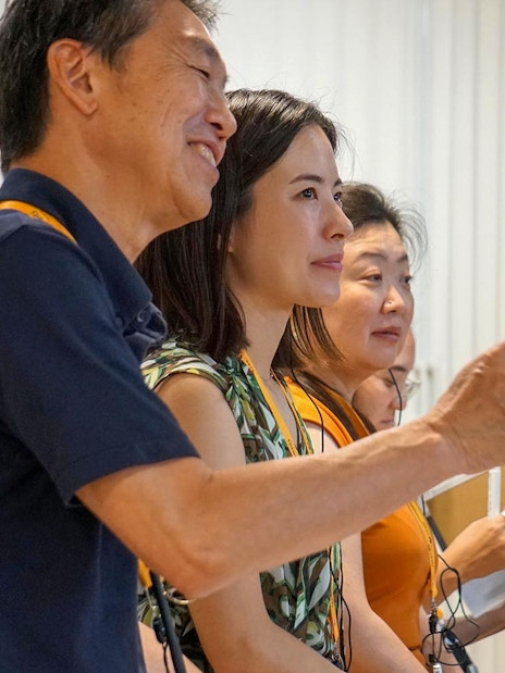 Guests observing inside a sumo stable in Japan.