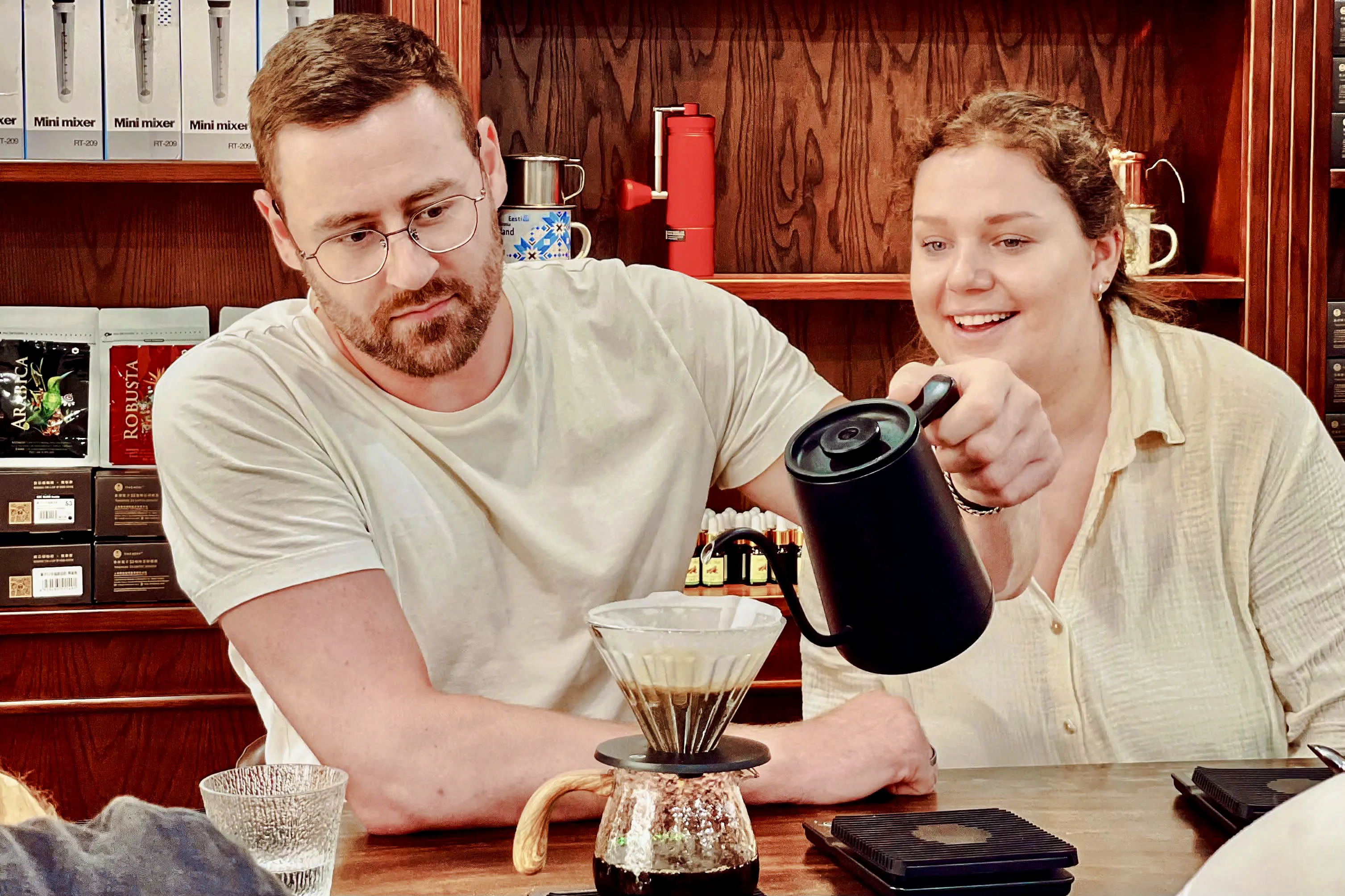 Brewing coffee at Hanoi workshop, focusing on egg, coconut, and salt coffee techniques.