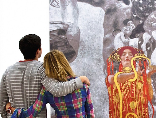 Couple admiring Klimt painting at Leopold Museum, Vienna.