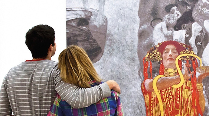 Couple admiring Klimt painting at Leopold Museum, Vienna.