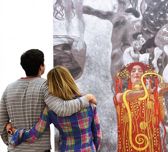 Couple admiring Klimt painting at Leopold Museum, Vienna.