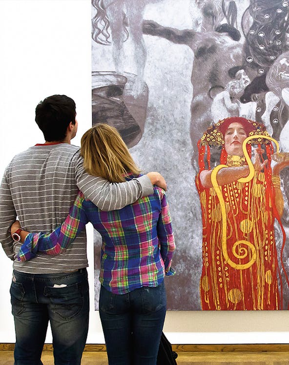 Couple admiring Klimt painting at Leopold Museum, Vienna.