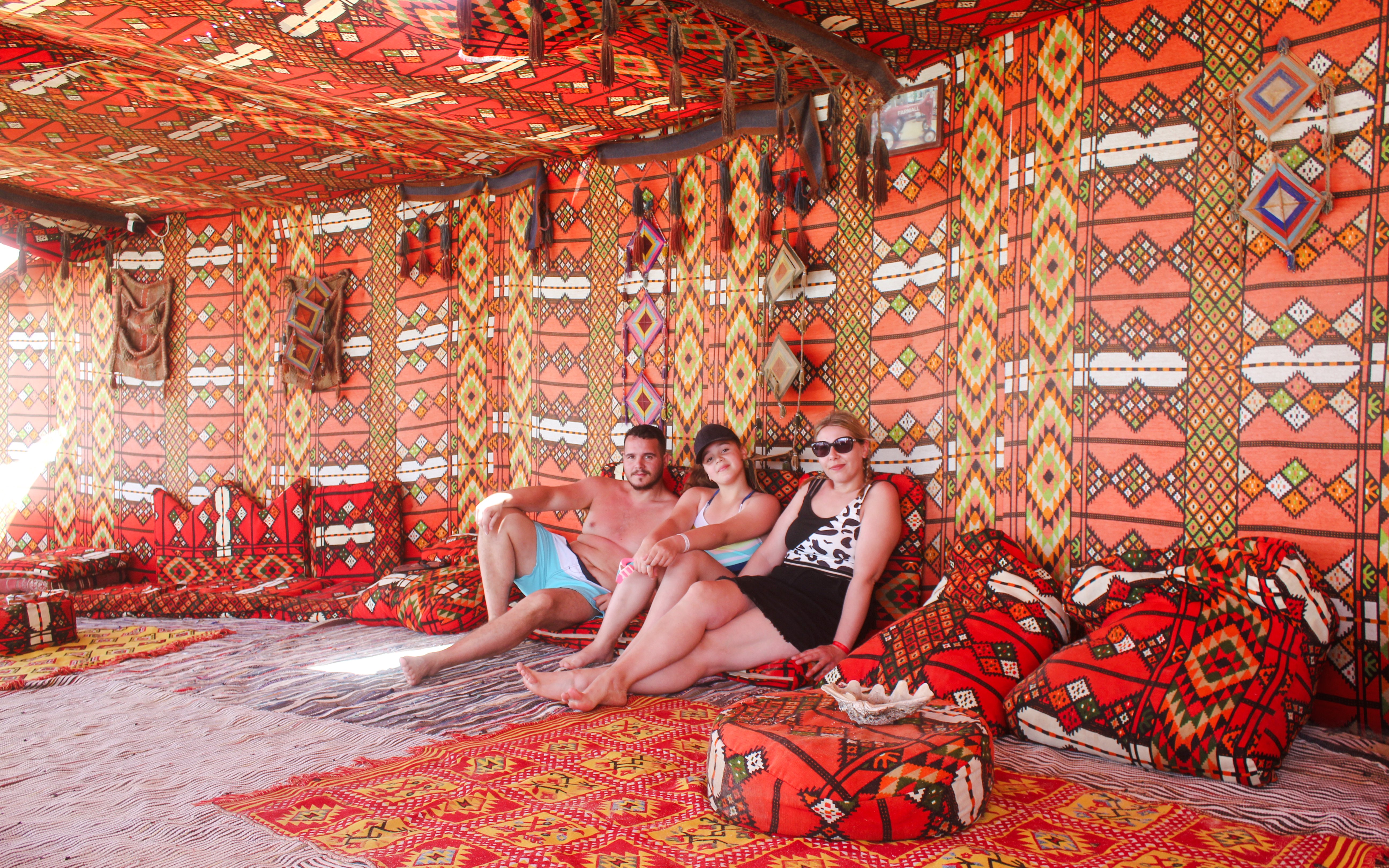 Visitors relaxing in a traditional Bedouin tent on the Giftun 3 Islands Tour.
