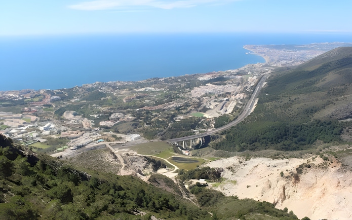 Aerial view from Monte Calamorro overlooking the coastline and landscape of Benalmádena, Spain.