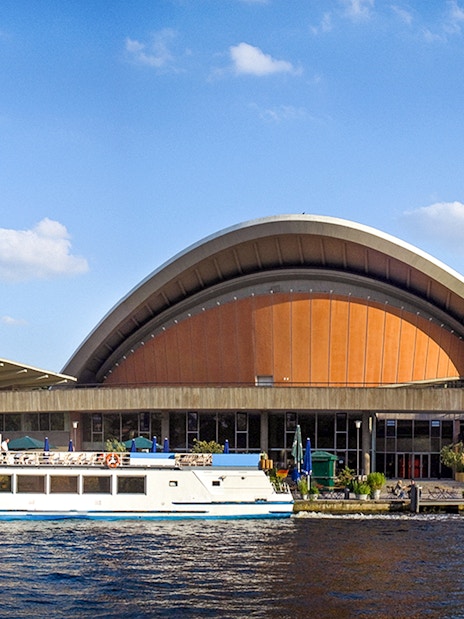 Berlin City Cruise boat in front of Haus der Kulturen der Welt.