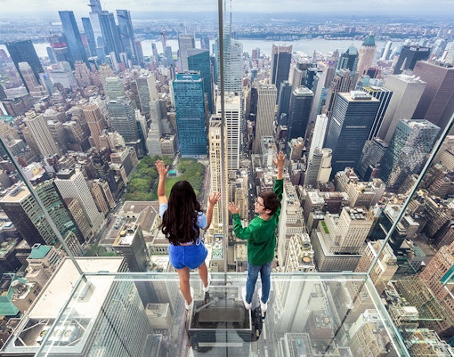 Children exploring interactive exhibit inside SUMMIT One Vanderbilt, New York City.