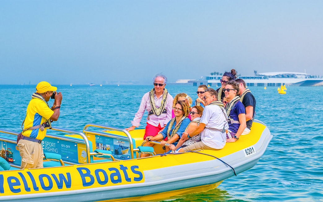 Group enjoying Dubai speedboat tour on the water.