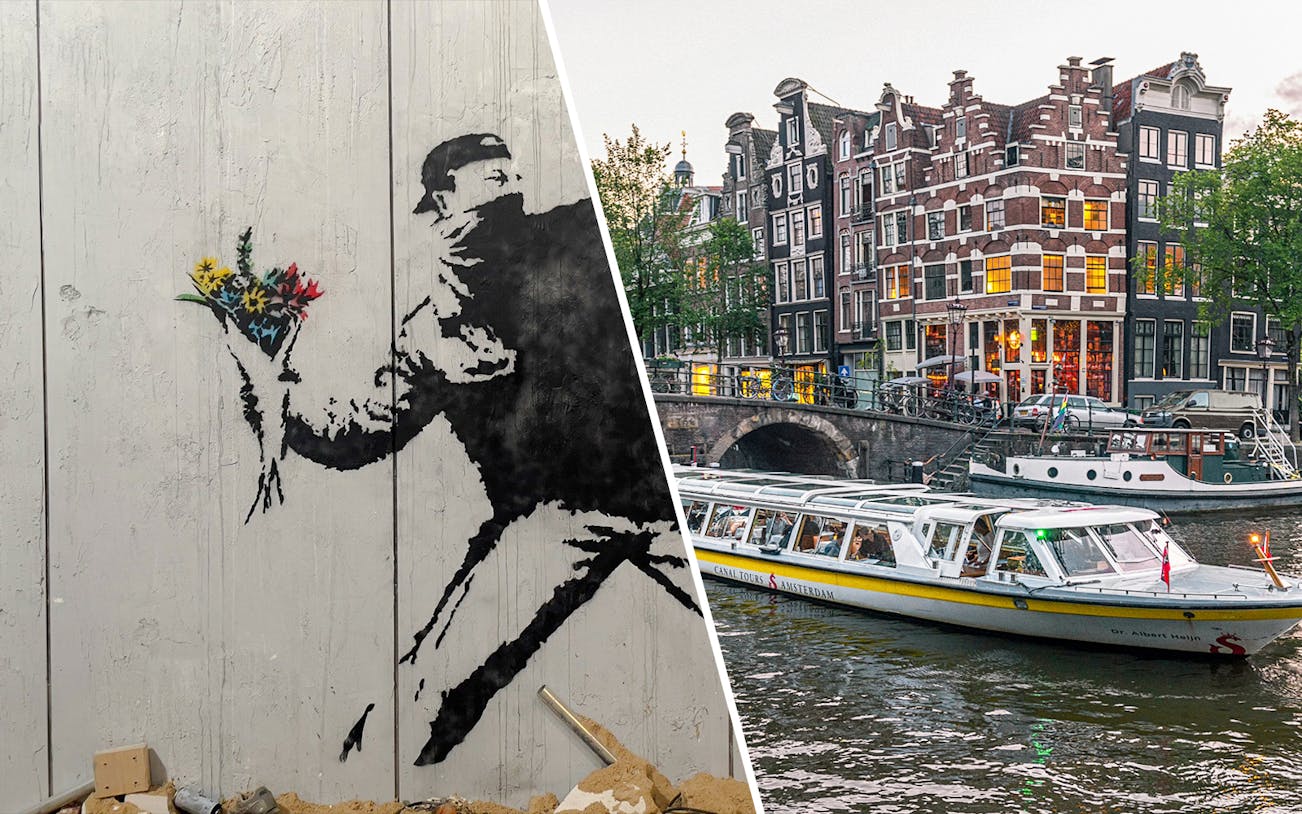 Banksy artwork with flowers and Amsterdam canal cruise boat near historic buildings.