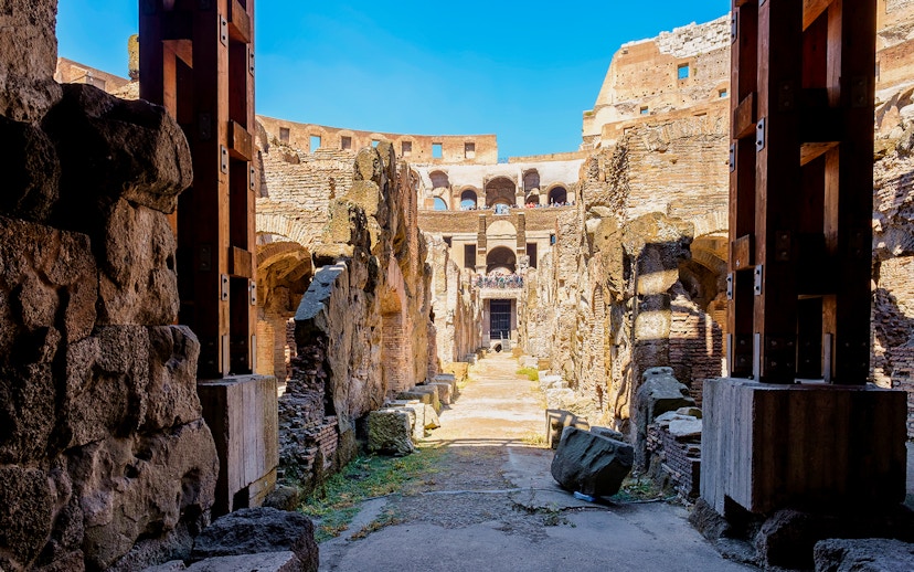 Colosseum underground passageway with ancient stone walls in Rome, Italy.