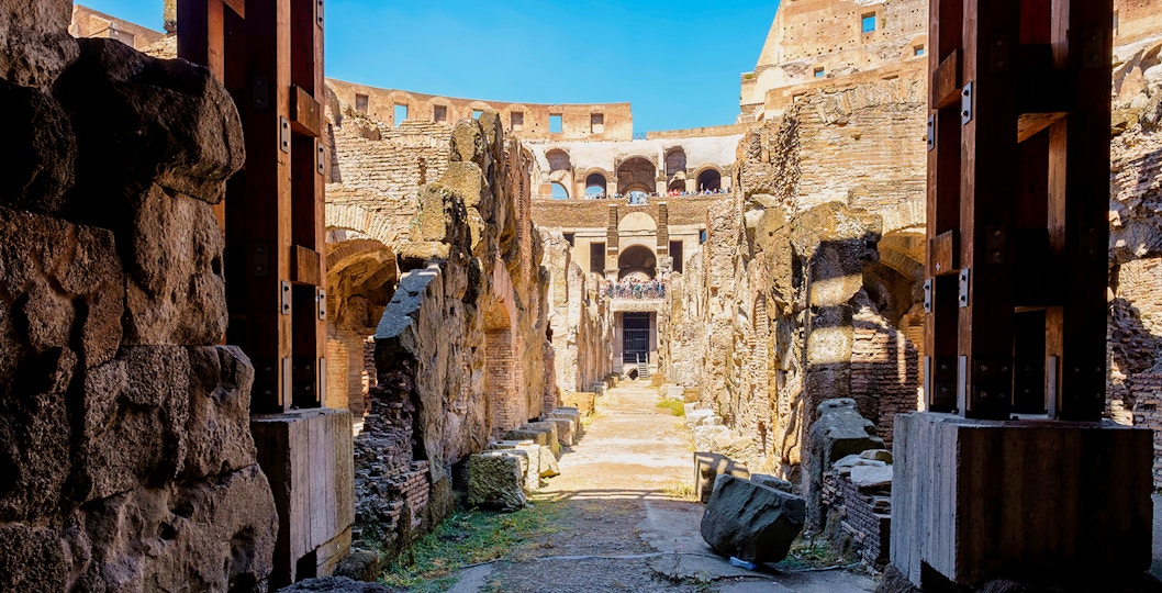 Colosseum underground passageway with ancient stone walls in Rome, Italy.