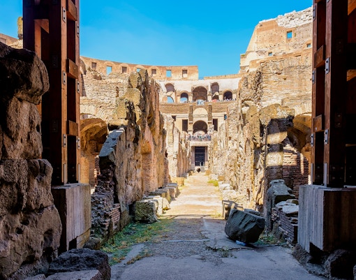 Colosseum underground passageway with ancient stone walls in Rome, Italy.