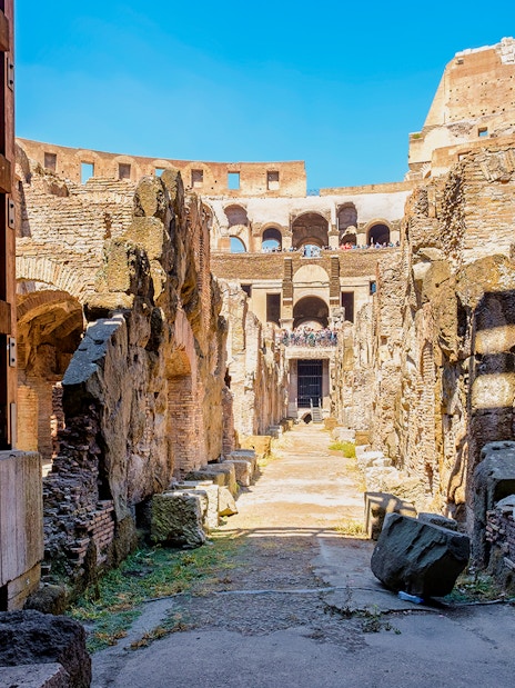 Colosseum underground passageway with ancient stone walls in Rome, Italy.