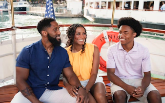 Family enjoying Chicago Architecture Cruise on a docked boat.