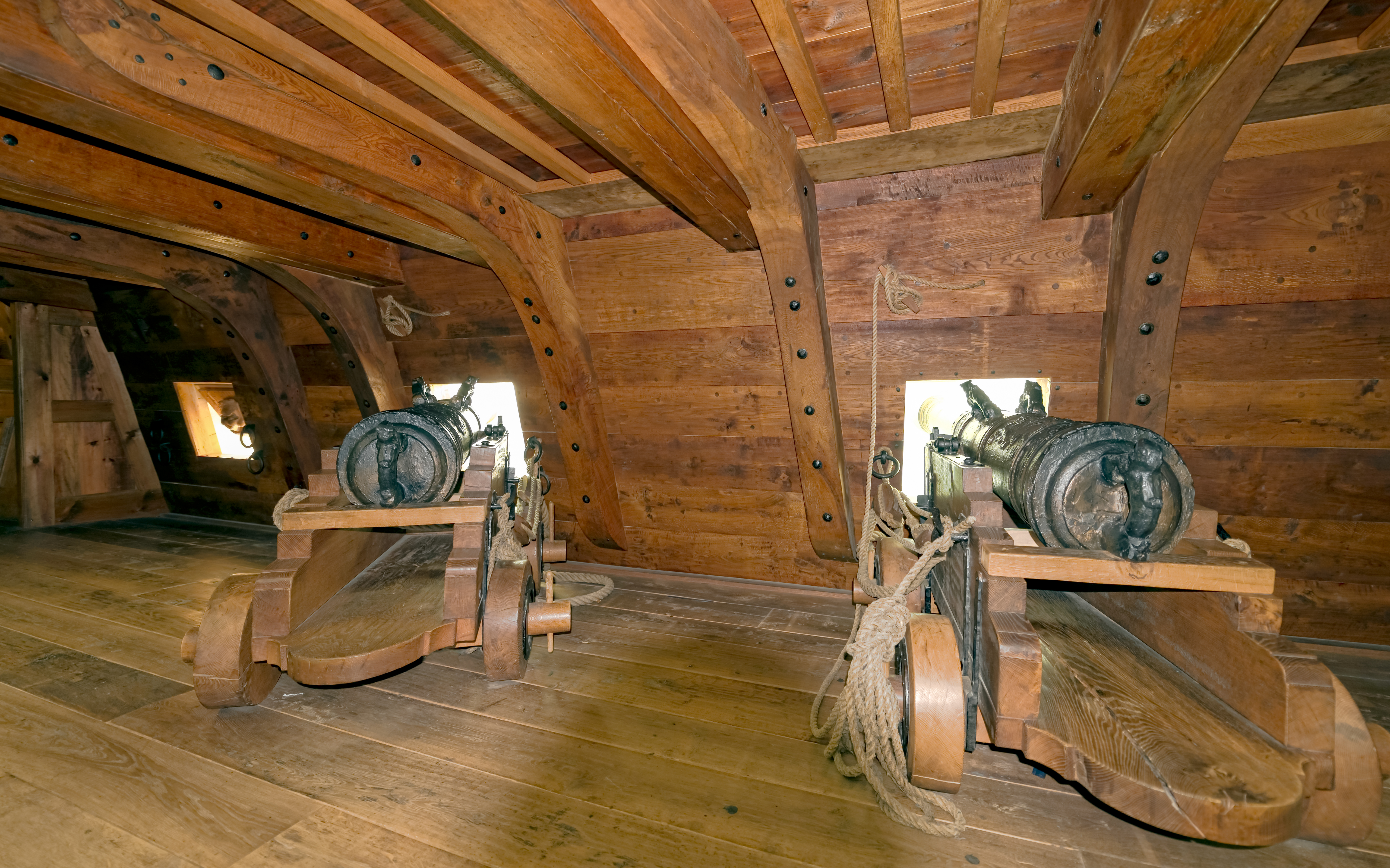 Canons inside a wooden ship at Vasa Museum, Stockholm, Sweden.