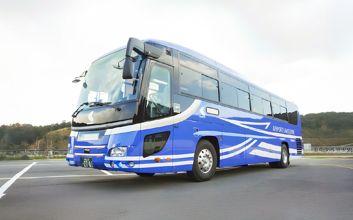 Kansai Airport transfer bus parked at the stop.