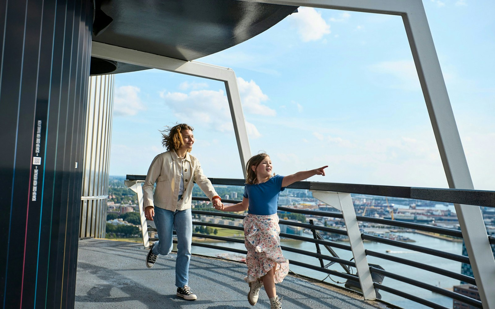 Visitors enjoying the panoramic view from the Euromast observation deck in Rotterdam.