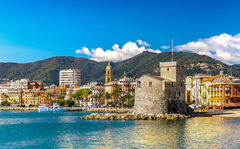 Rapallo seaside with historic castle and colorful buildings, day trip from Genoa to Portofino.