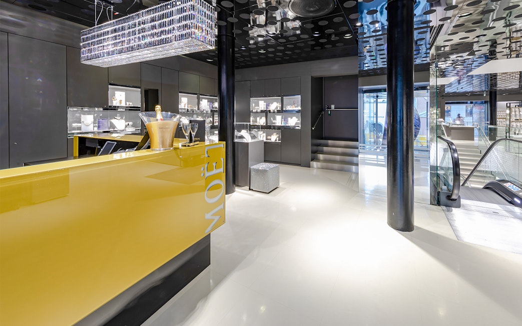Swarovski House interior in Vienna with champagne display and jewelry showcases.