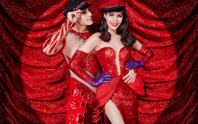 Characters in festive costumes at Paradis Latin cabaret.