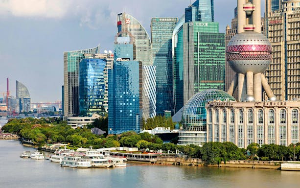Shanghai skyline with Oriental Pearl TV Tower and Huangpu River.