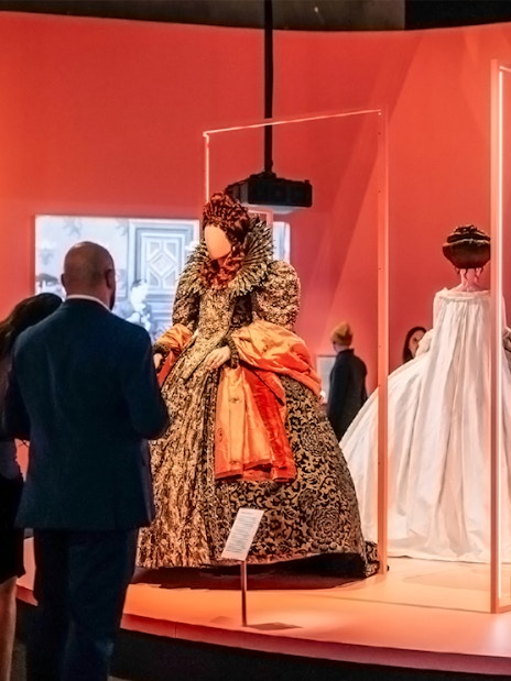 Visitors viewing historical costumes at Art Science Museum's Future World exhibit.